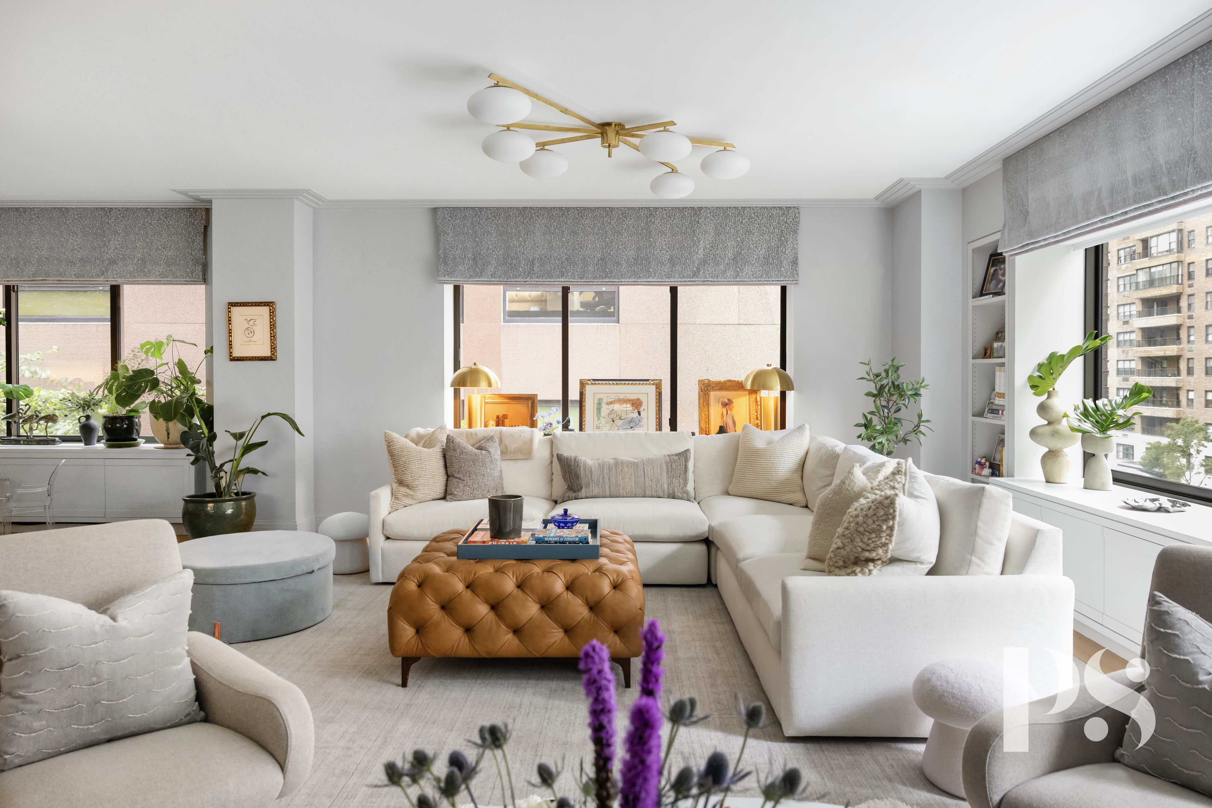 733 Park Avenue, Unit 4 Manhattan, NY 10021 - Photo 5 of 29 a living room with furniture and a large window