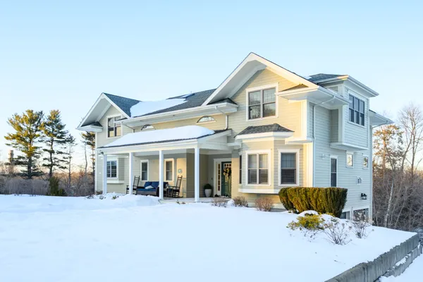 a front view of a house with a yard