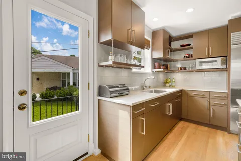 a kitchen with stainless steel appliances granite countertop a stove and a refrigerator