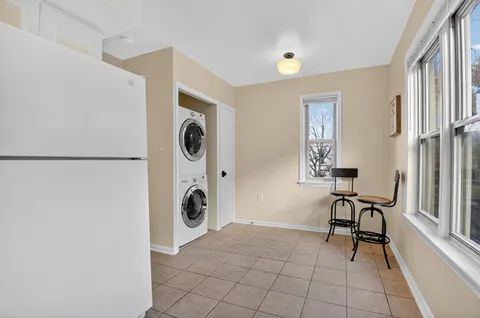 a view of a livingroom with furniture and a window