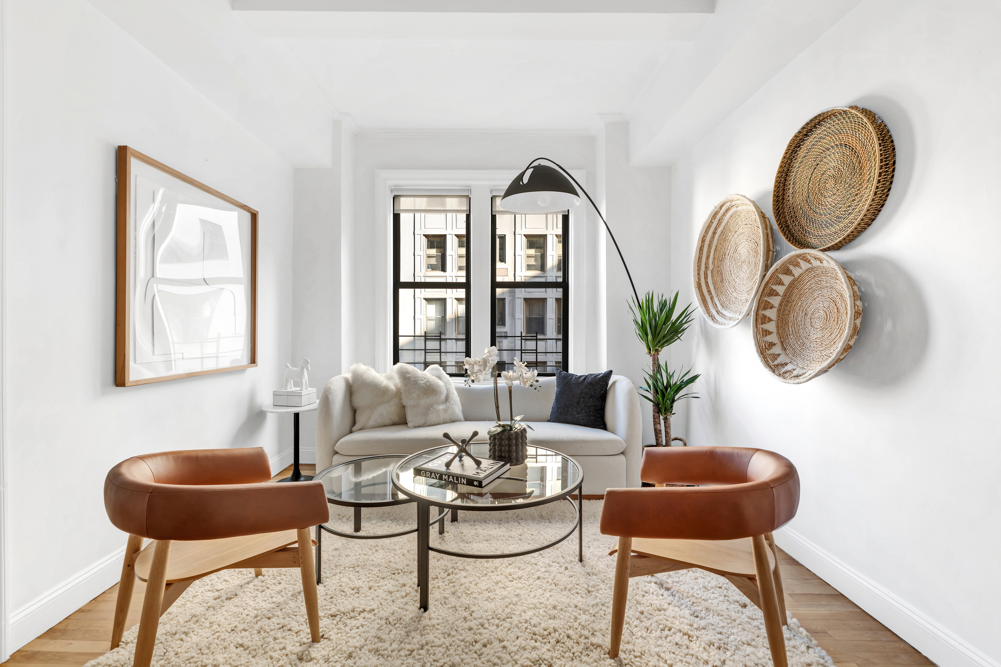 599 West End Avenue, Unit 7BC Manhattan, NY 10024 - Photo 3 of 11 a living room with furniture and a large window