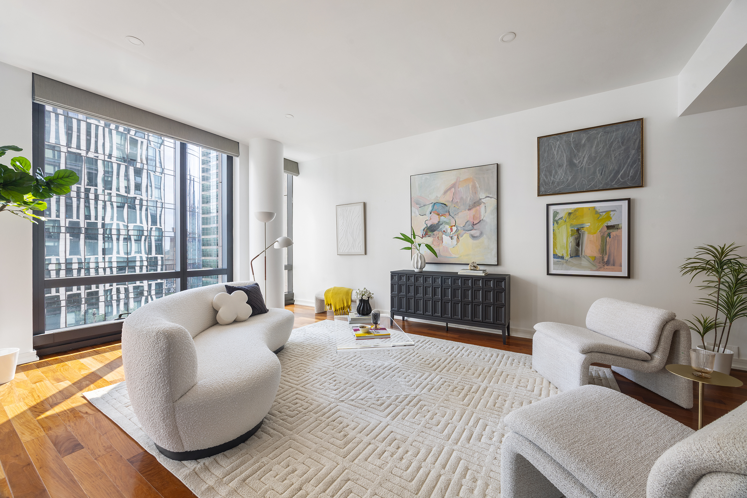 101 Warren Street, Unit 12L Manhattan, NY 10007 - Photo 2 of 28 a bedroom with furniture and a large window