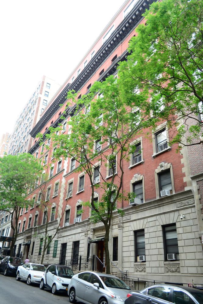 310 West 97th Street, Unit 21 Manhattan, NY 10025 - Photo 2 of 19 a front view of a building with street view