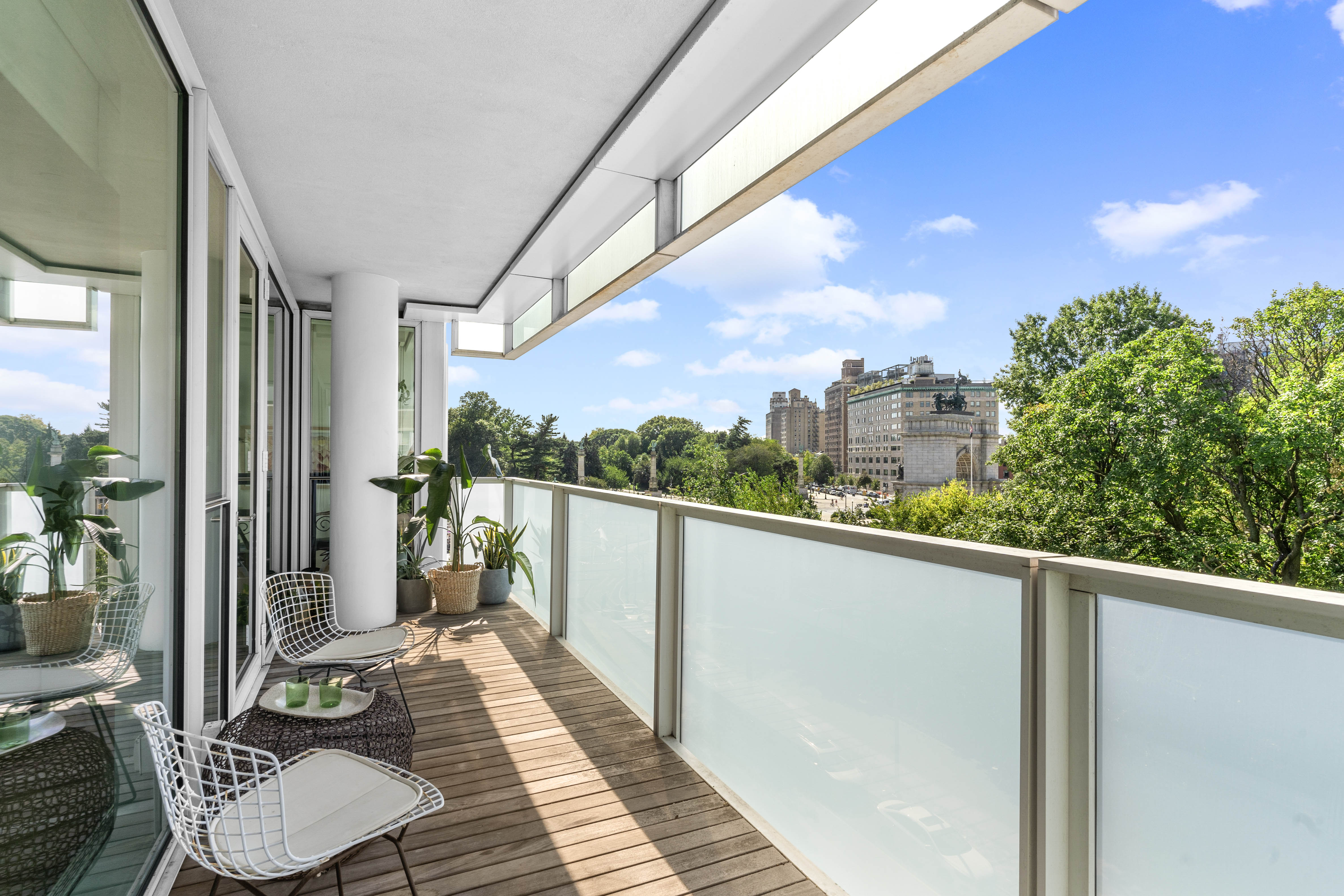 1 Grand Army Plaza, Unit 5E Brooklyn, NY 11238 - Photo 1 of 21 a balcony with furniture and a potted plant