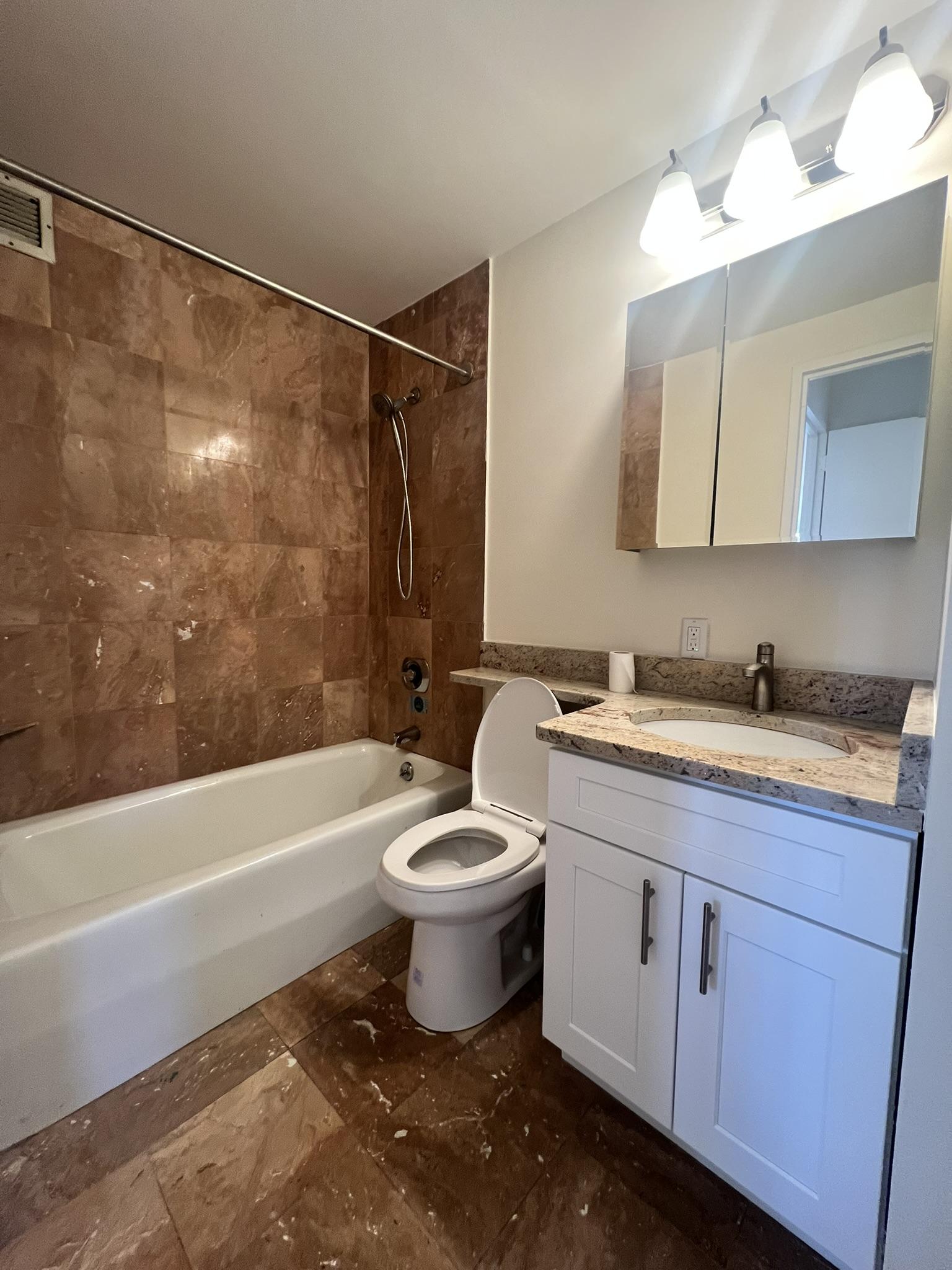 250 West 90th Street, Unit PH2F Manhattan, NY 10024 - Photo 4 of 21 a bathroom with a sink toilet a bathtub and a shower