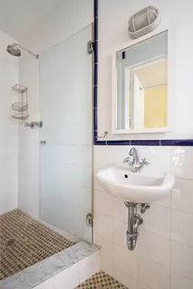 a bathroom with a sink toilet and mirror