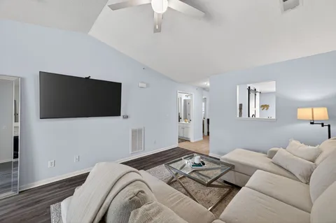 a living room with a couch and a flat screen tv