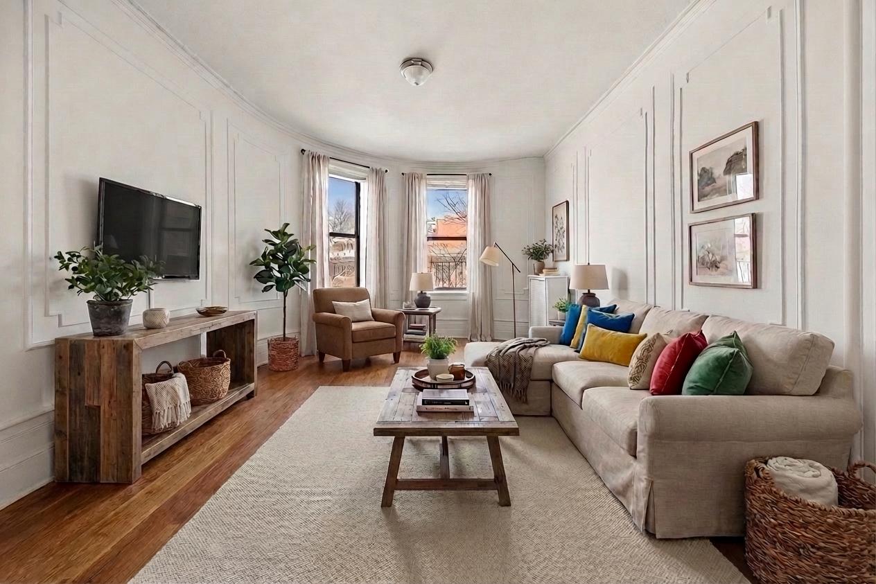 310 Windsor Place, Unit 32 Brooklyn, NY 11218 - Photo 1 of 19 a living room with furniture and a flat screen tv