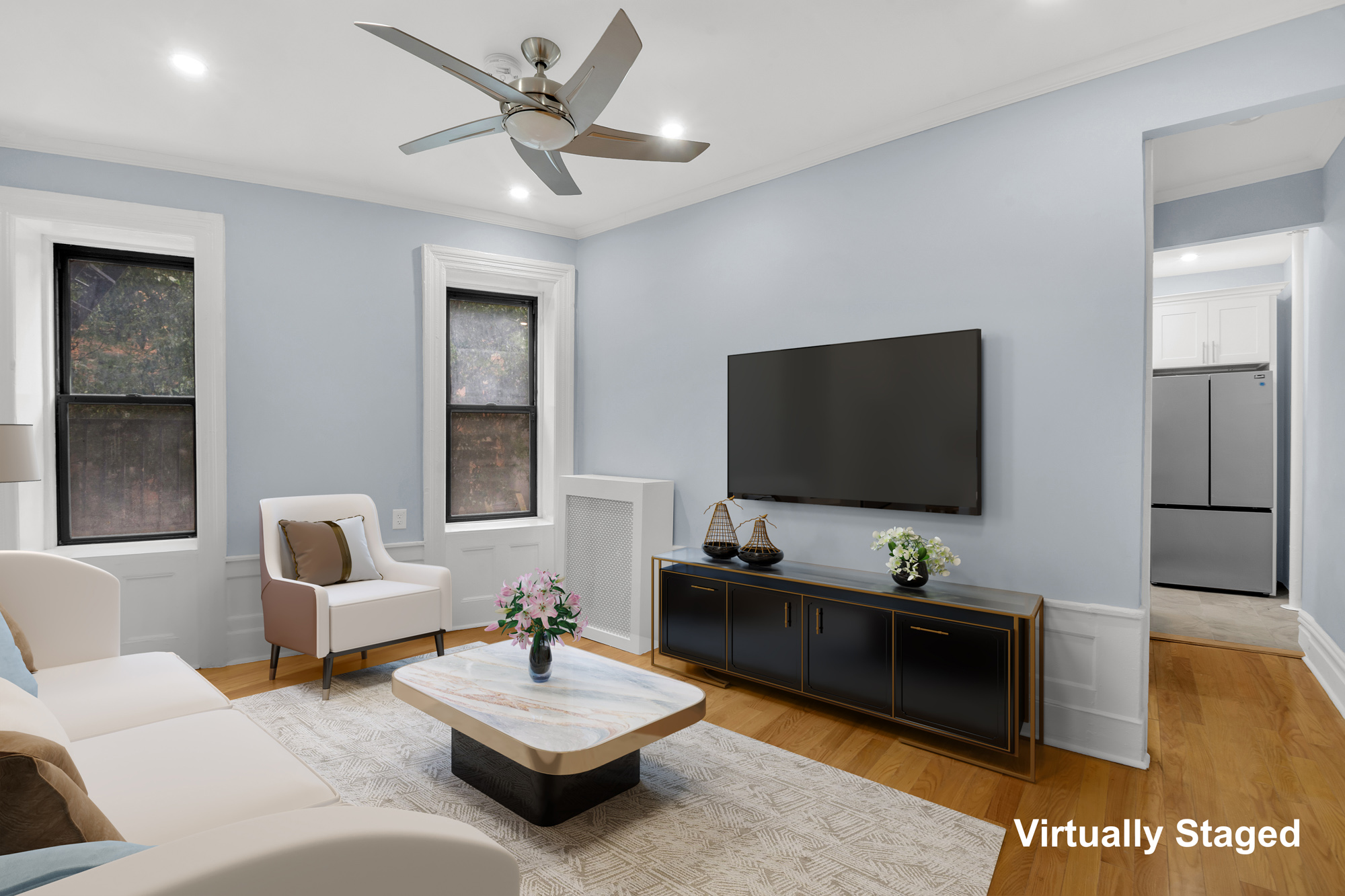 100 Hamilton Place, Unit 2F Manhattan, NY 10031 - Photo 3 of 21 a living room with furniture and a flat screen tv
