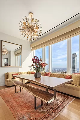 252 East 57th Street, Unit 62B Manhattan, NY 10022 - Photo 3 of 15 a living room with furniture and a large window