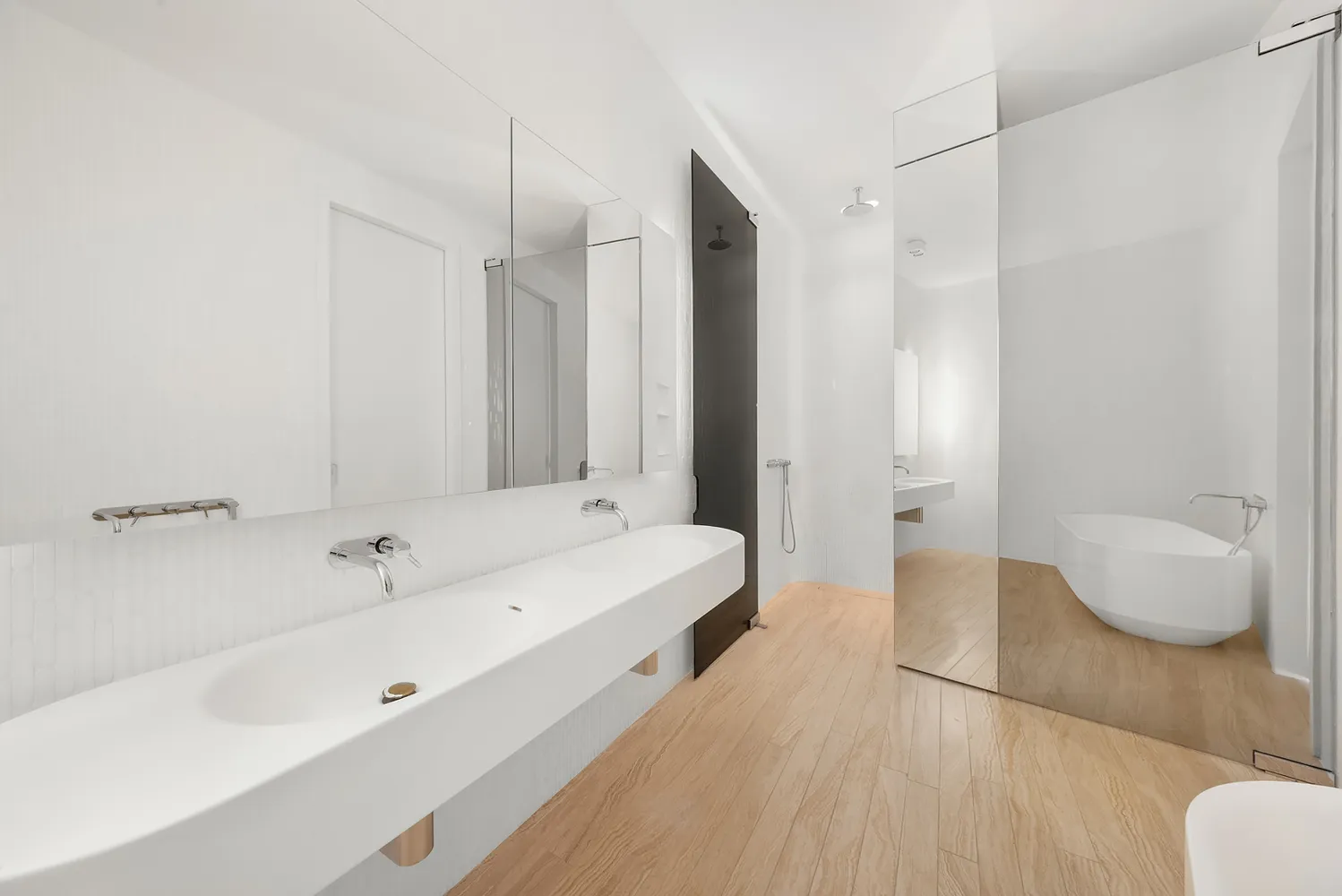 a spacious bathroom with a tub and shower