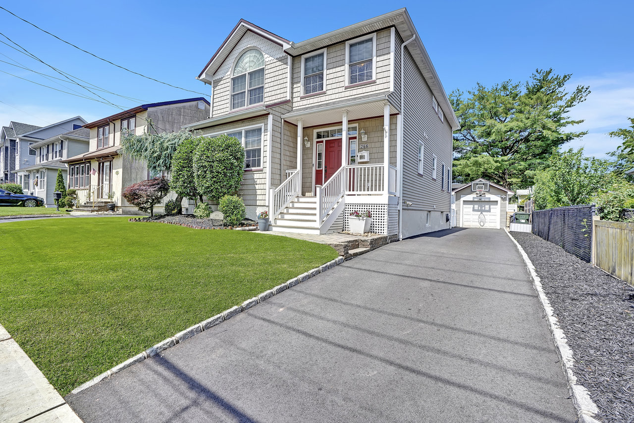 266 Feronia Way Rutherford, NJ 07070 - Photo 3 of 41 a front view of a house with a yard
