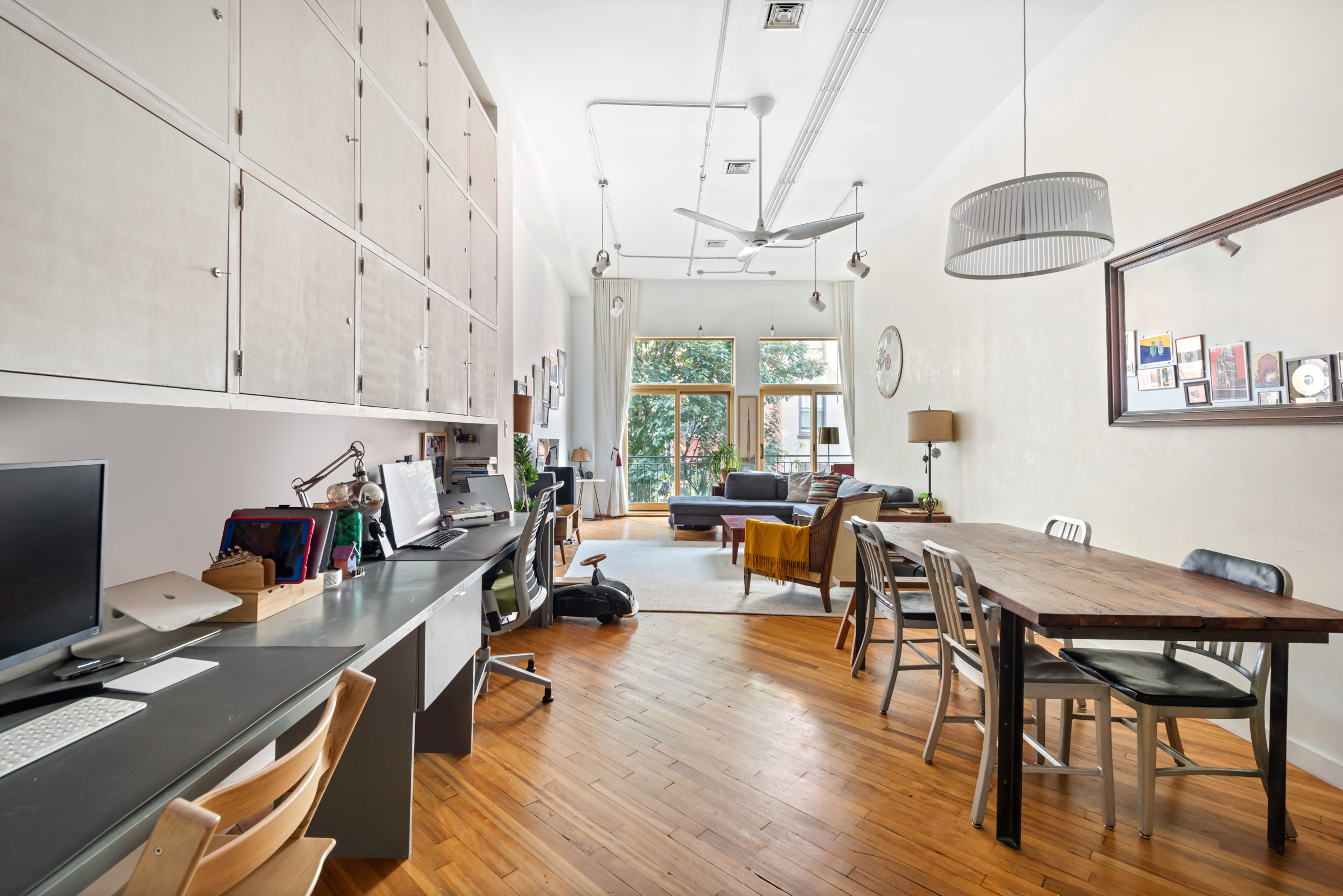 105 Lexington Avenue, Unit 2G Brooklyn, NY 11238 - Photo 7 of 17 a view of a dining room with furniture a chandelier and wooden floor
