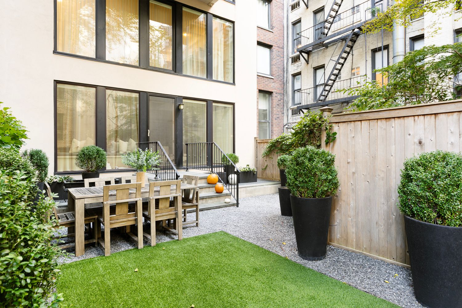 554 East 82nd Street, Unit 1/2 Manhattan, NY 10028 - Photo 12 of 13 a view of a house with backyard porch and sitting area