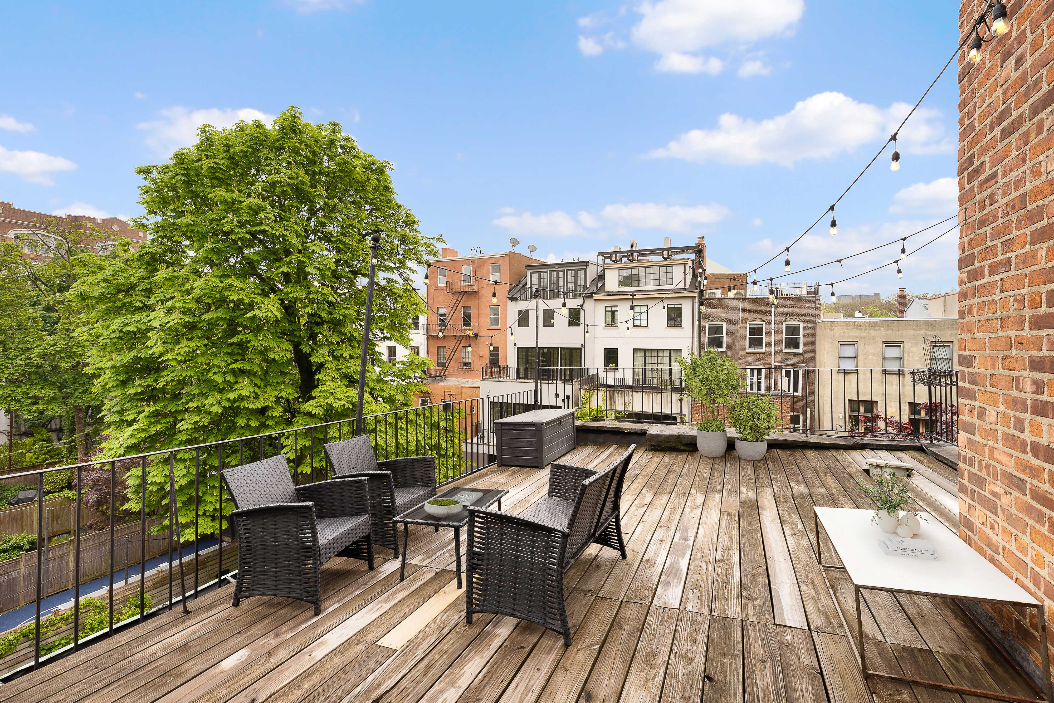 144 Baltic Street Brooklyn, NY 11201 - Photo 9 of 14 a view of a balcony with chairs and wooden floor