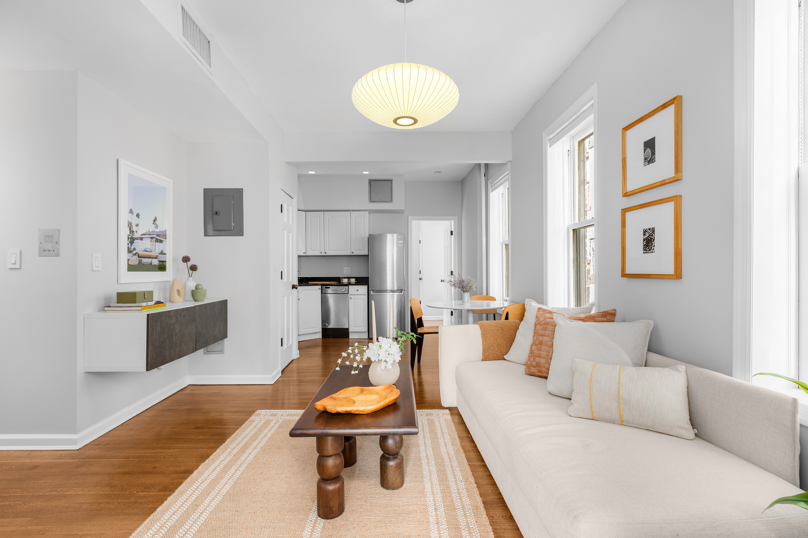 92 Perry Street, Unit 6 Manhattan, NY 10014 - Photo 5 of 10 a living room with furniture and a rug