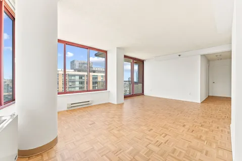 a view of an empty room with a window