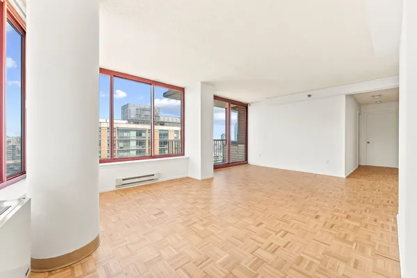 a view of an empty room with a window