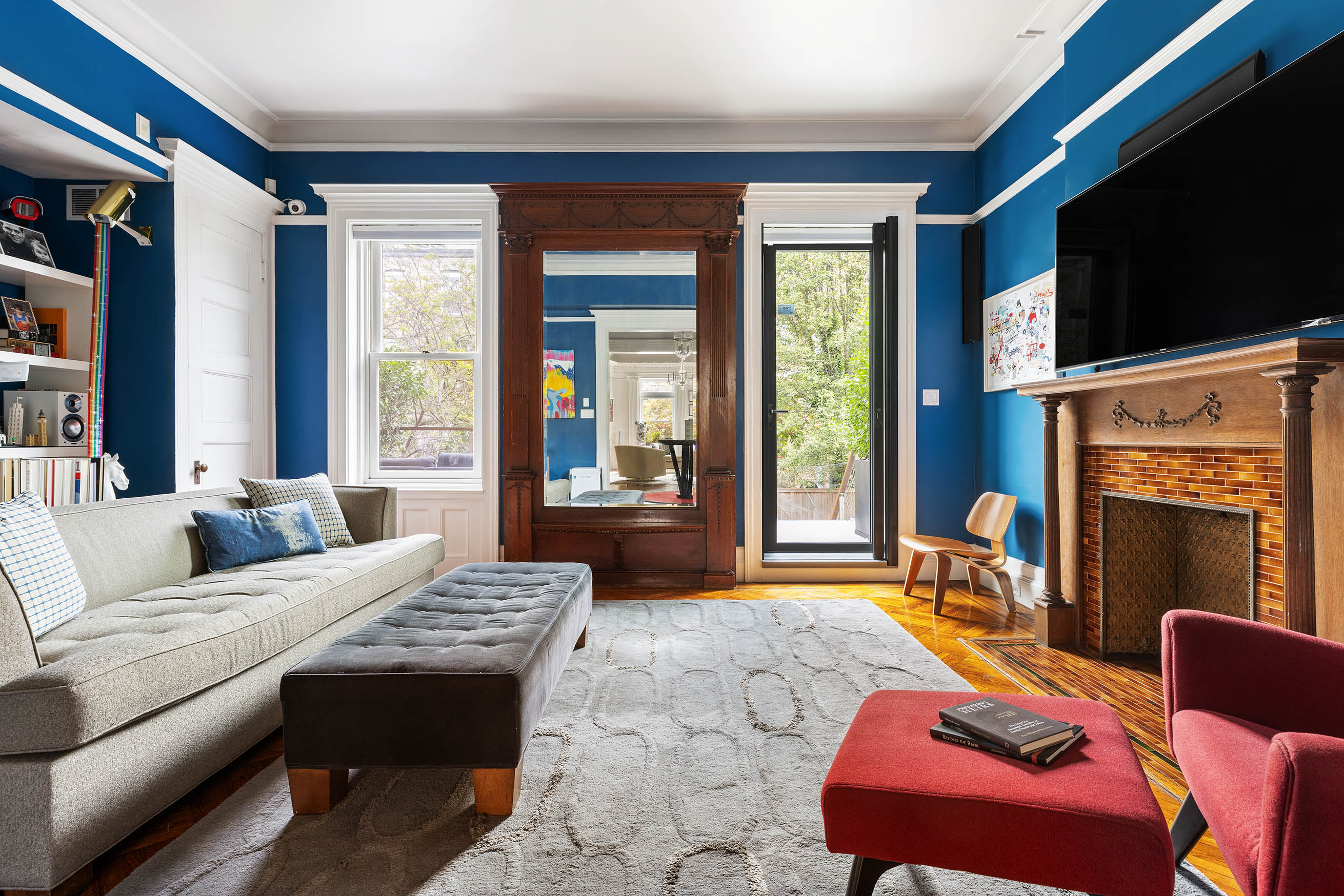 49 Rutland Road Brooklyn, NY 11225 - Photo 4 of 22 a living room with furniture a flat screen tv and a fireplace