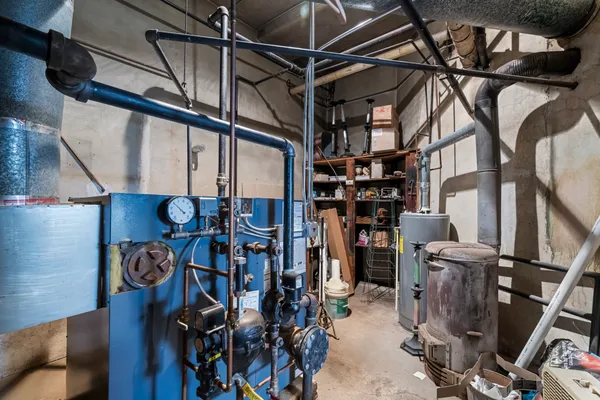 a kitchen with a refrigerator and a stove