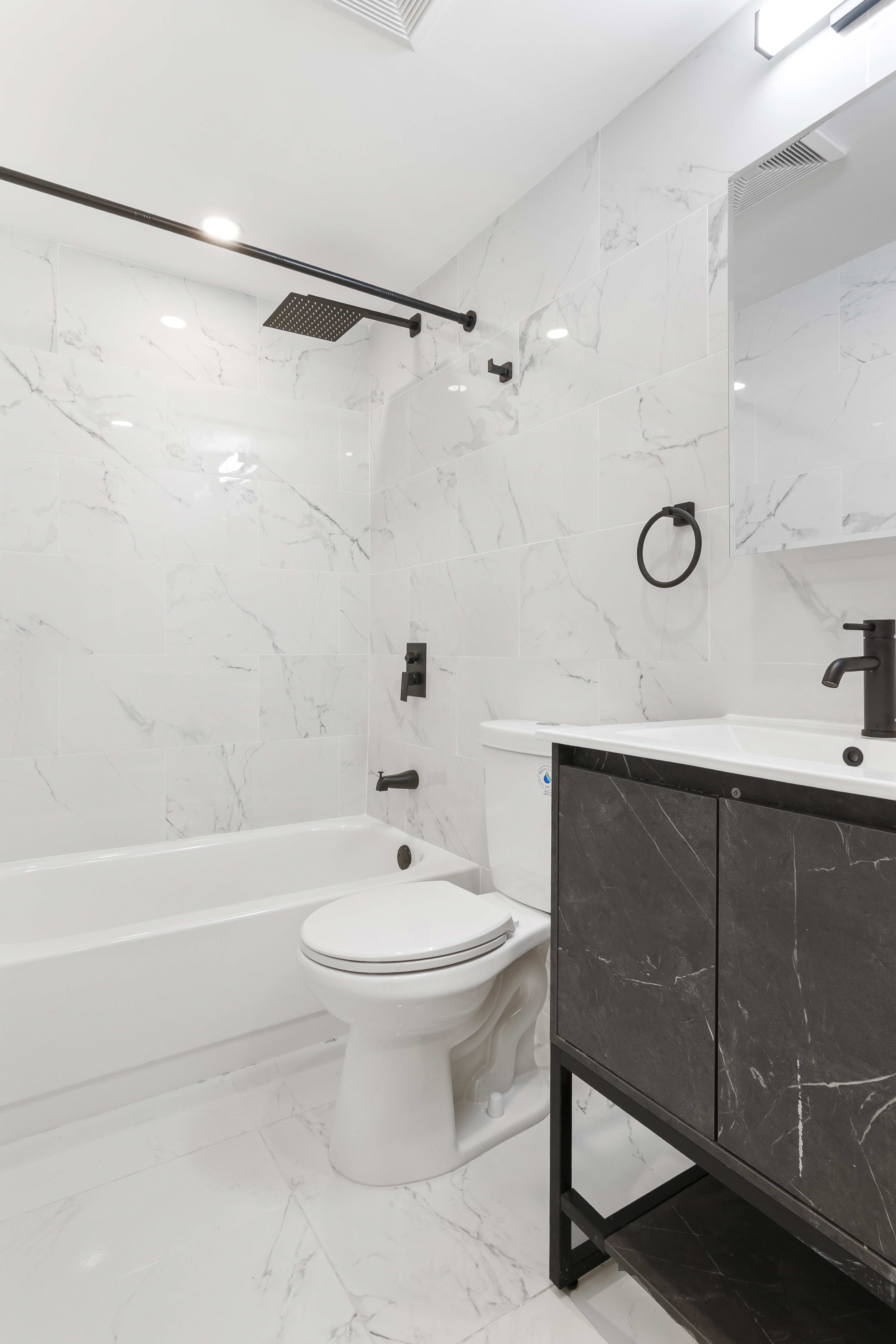 297 3rd Avenue, Unit 1 Brooklyn, NY 11215 - Photo 6 of 8 a bathroom with a sink toilet and shower