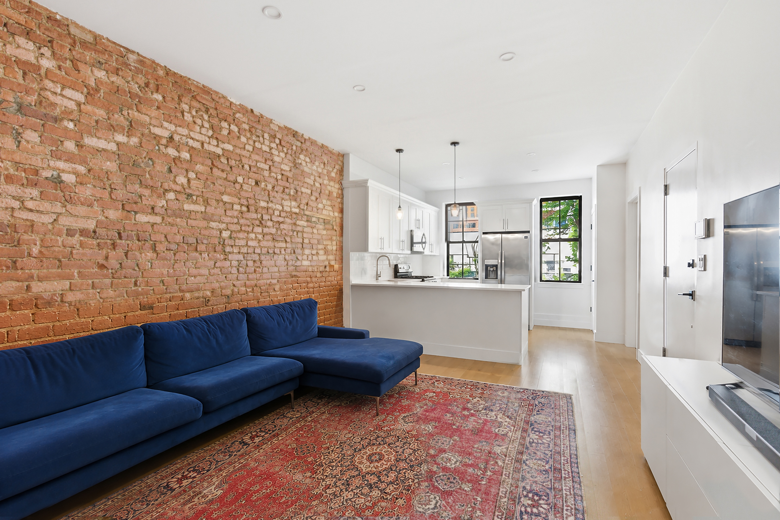 29 Greenpoint Avenue Brooklyn, NY 11222 - Photo 9 of 18 a living room with furniture and a rug