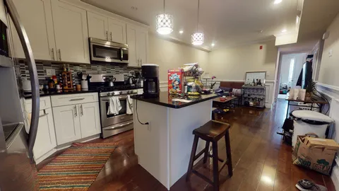 a view of a kitchen with appliances and cabinets