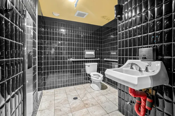 a view of a dining hall with many windows