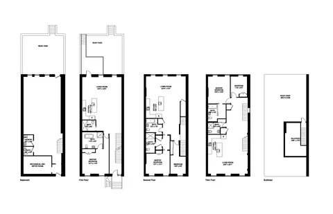 a black white and white photo of a living room