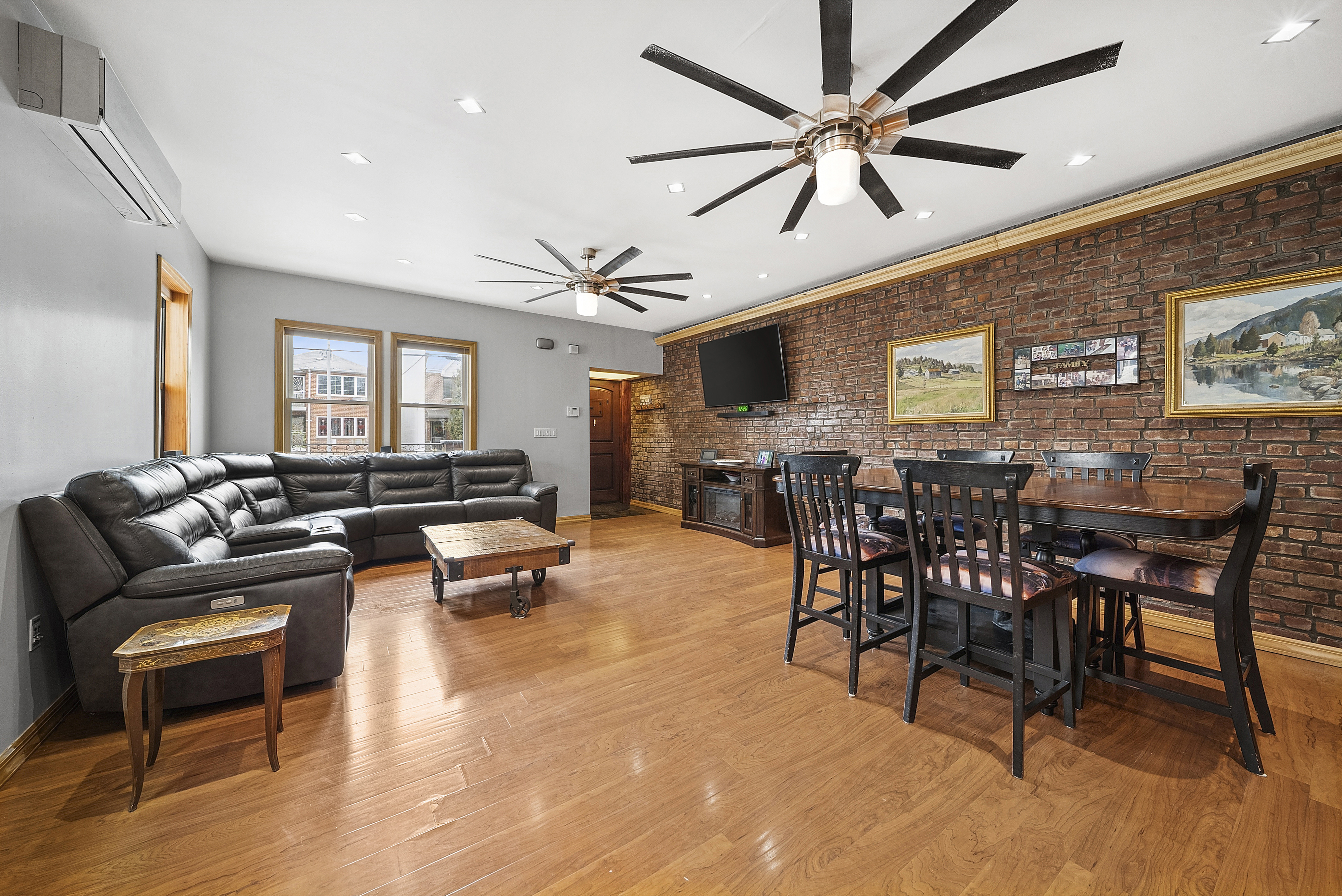 203 Battery Avenue Brooklyn, NY 11209 - Photo 3 of 14 a living room with furniture a dining table and kitchen view