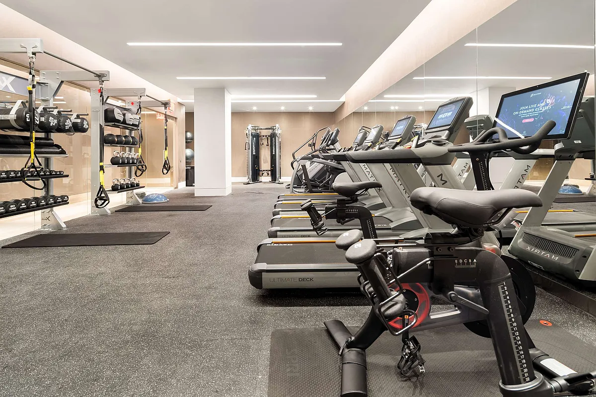 49 Chambers Street, Unit 9G Manhattan, NY 10007 - Photo 20 of 28 a room with gym equipment and air hockey table