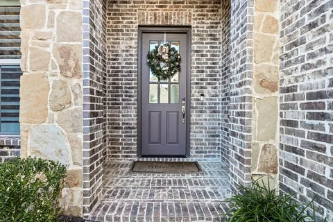 a view of a door and a window