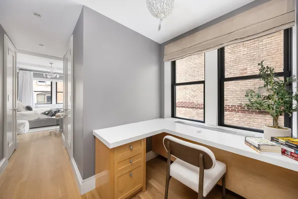 a bathroom with double vanity and a bathtub
