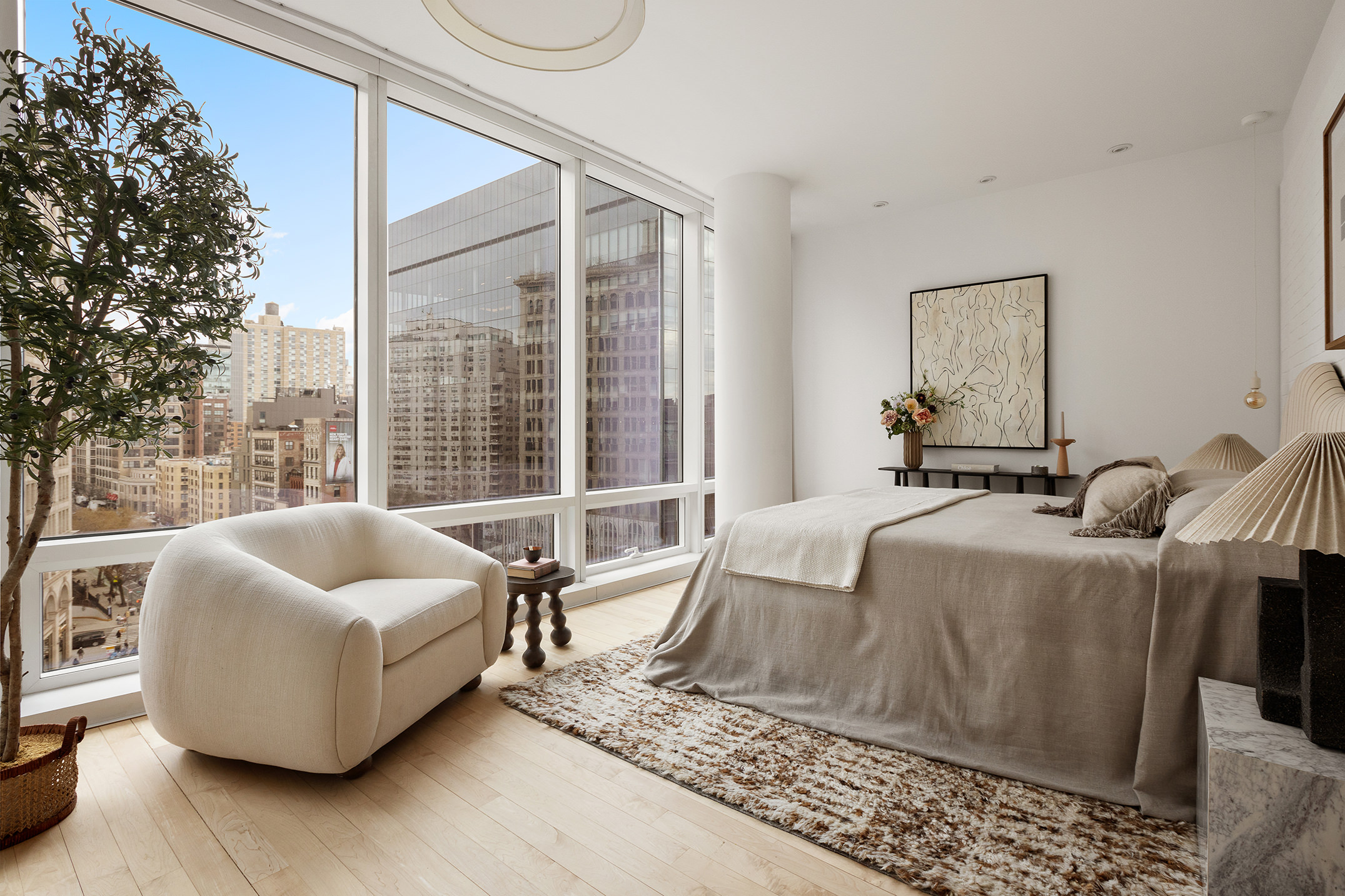 445 Lafayette Street, Unit 9C Manhattan, NY 10003 - Photo 5 of 10 a living room with furniture and a floor to ceiling window