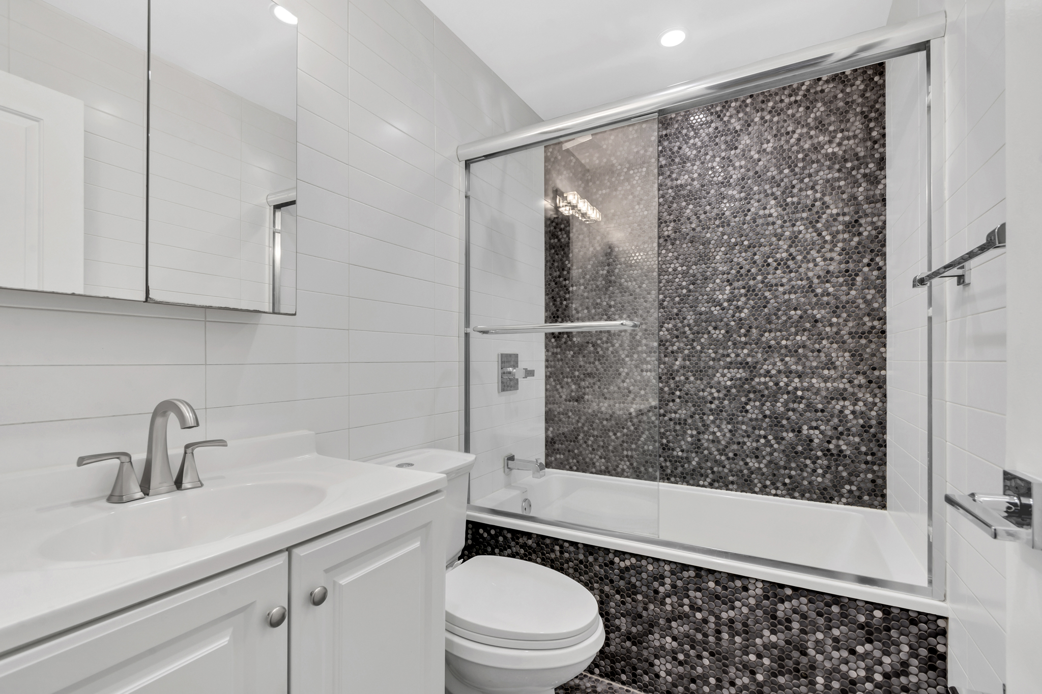 28 Roosevelt Place, Unit 2 Brooklyn, NY 11233 - Photo 9 of 12 a bathroom with a sink toilet and shower