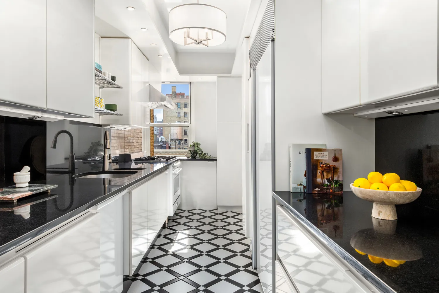 a kitchen with stainless steel appliances kitchen island granite countertop a sink and cabinets