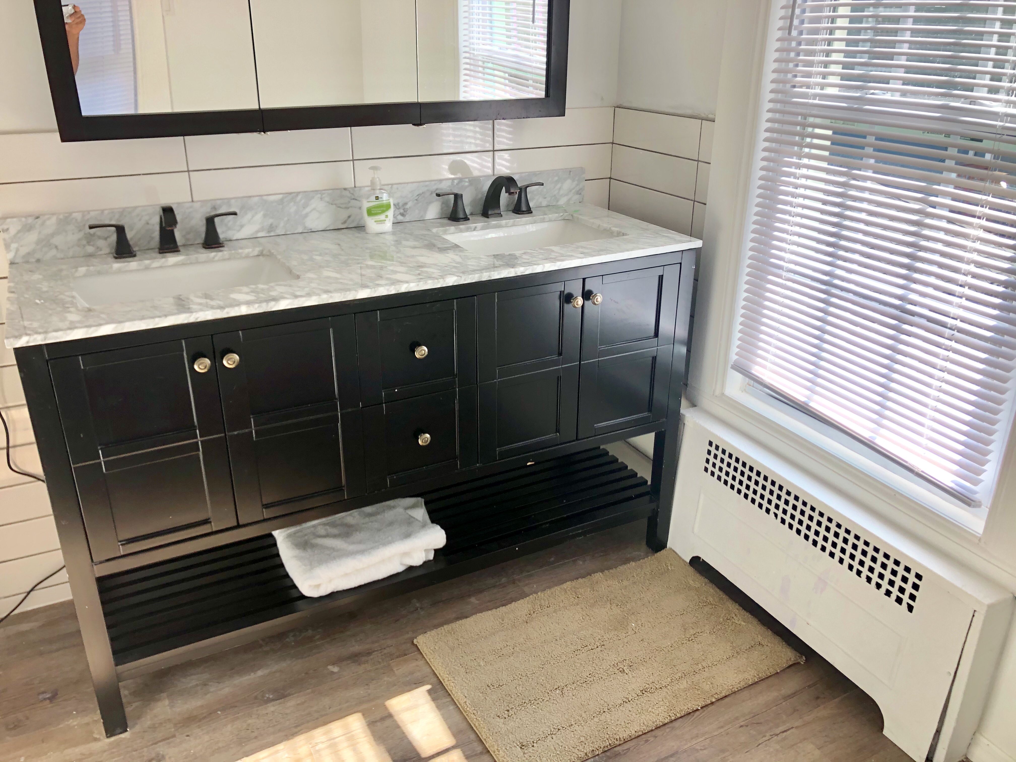 1112 Beverley Road Brooklyn, NY 11218 - Photo 43 of 53 a bathroom with a sink and a mirror