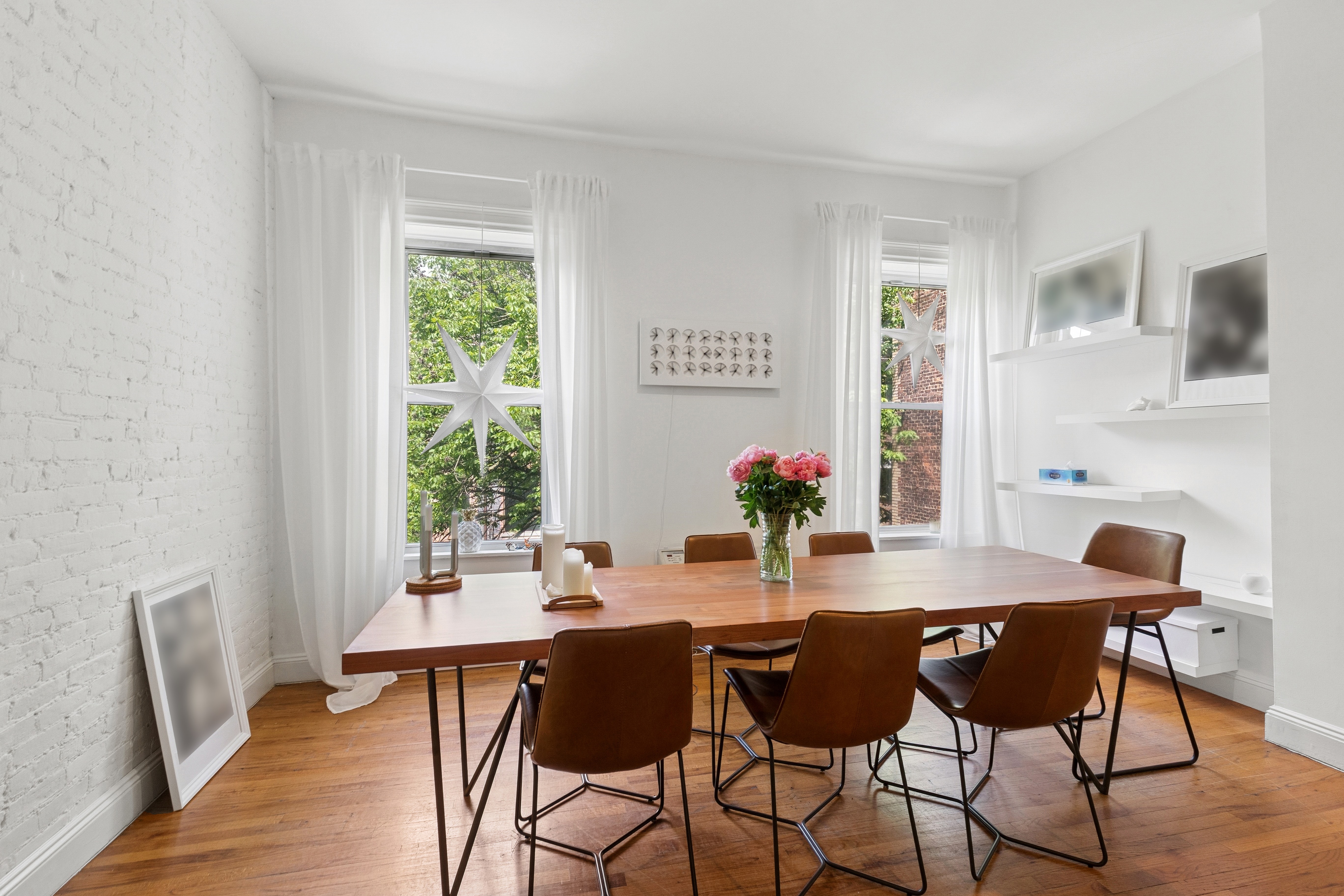 53 West 82nd Street, Unit 2 Manhattan, NY 10024 - Photo 2 of 10 a view of a dining room with furniture and a window