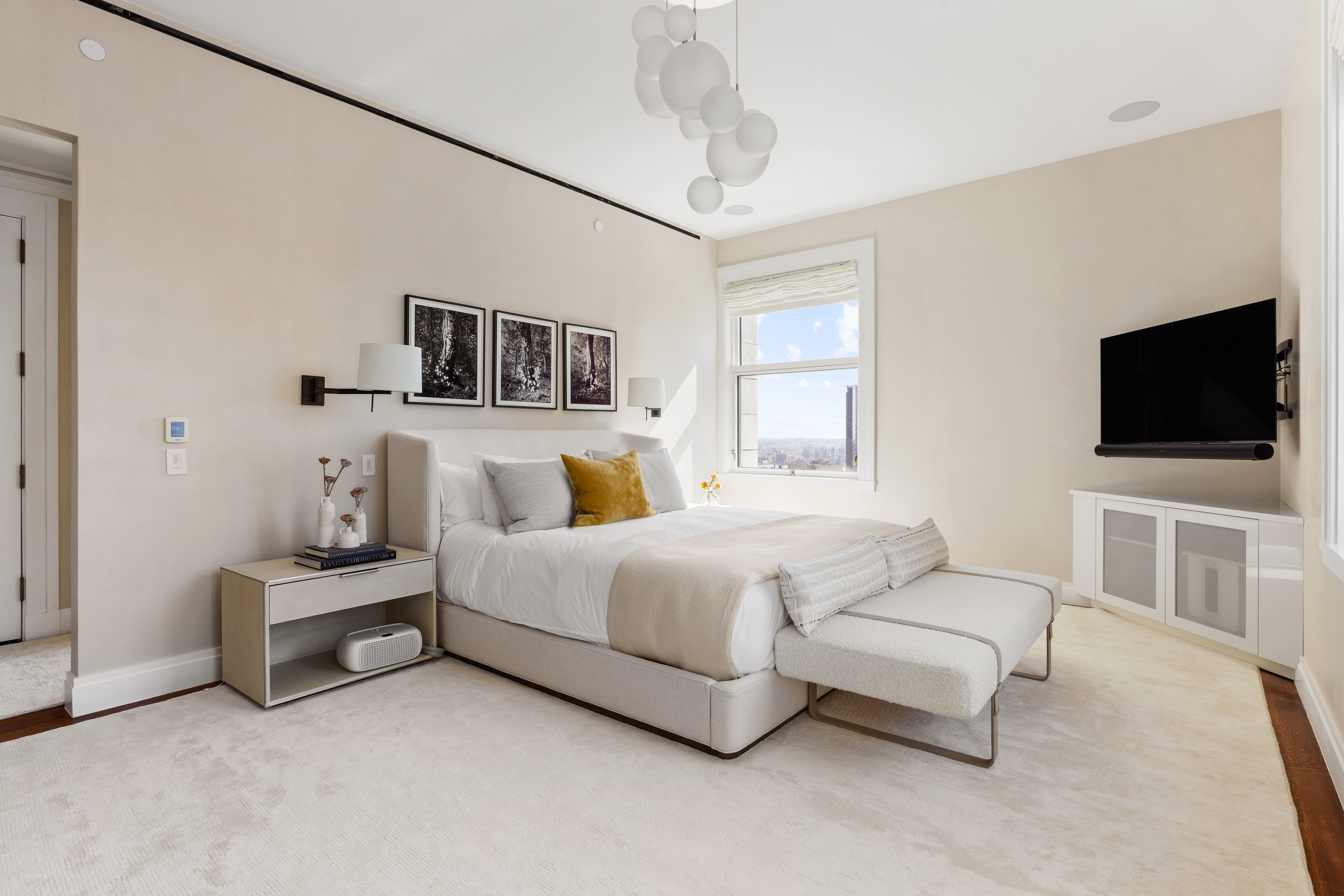 2 Park Place, Unit 35A Manhattan, NY 10007 - Photo 7 of 21 a spacious bedroom with a bed and a flat screen tv