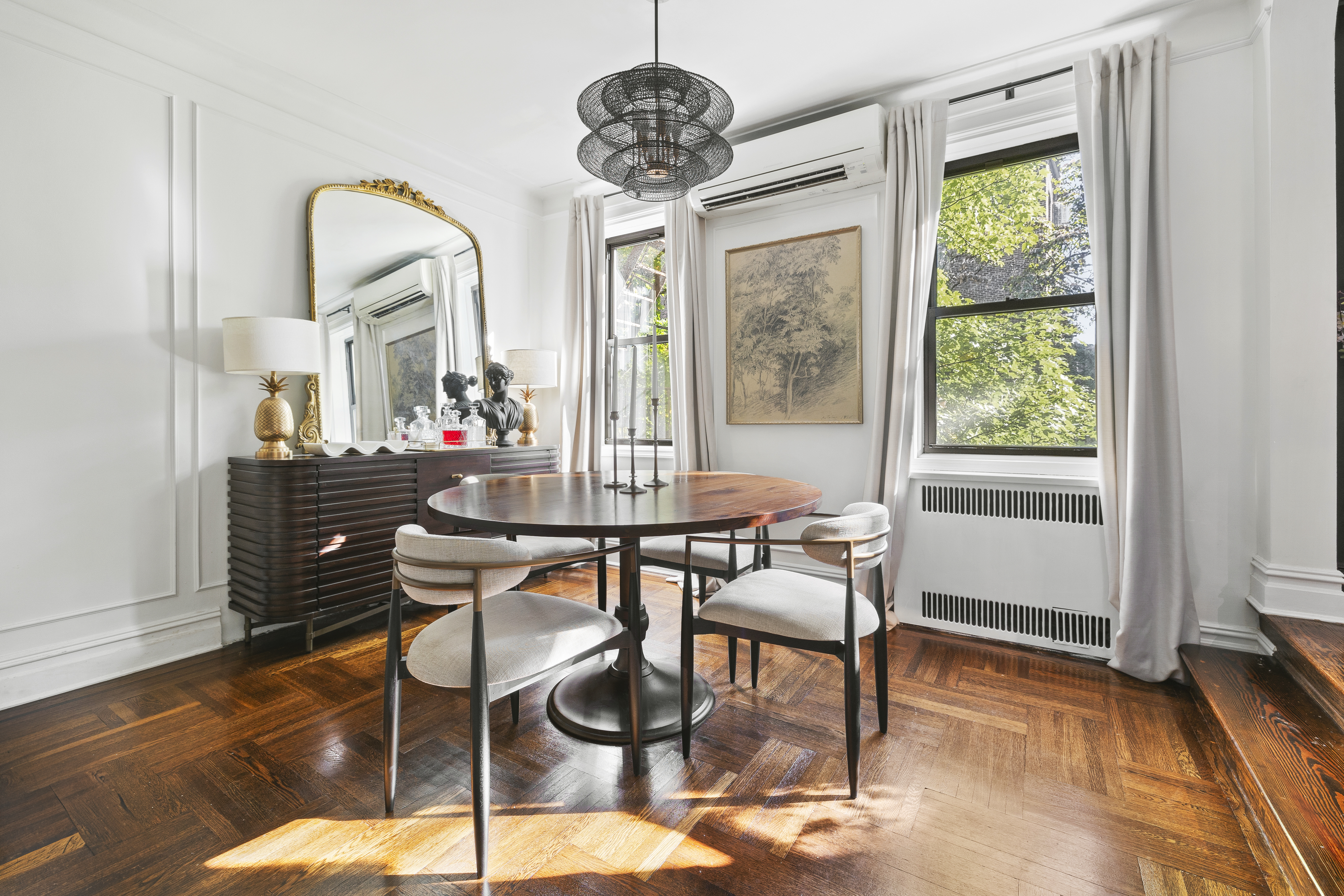 125 Ocean Avenue, Unit 2G Brooklyn, NY 11225 - Photo 3 of 16 a dining room with furniture a chandelier and wooden floor