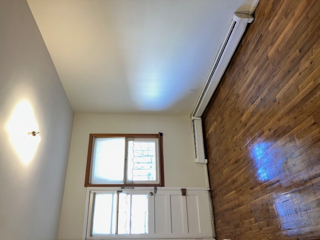 1653 West 9th Street, Unit 2 Brooklyn, NY 11223 - Photo 7 of 7 an empty room with wooden floor and windows