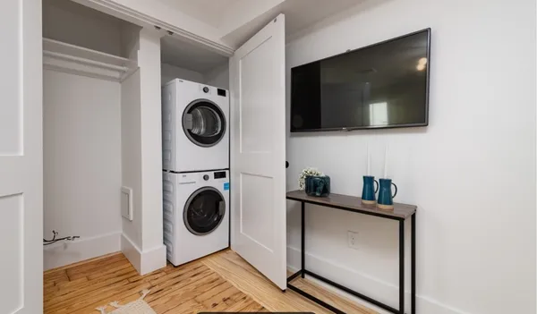a utility room with sink dryer and washer