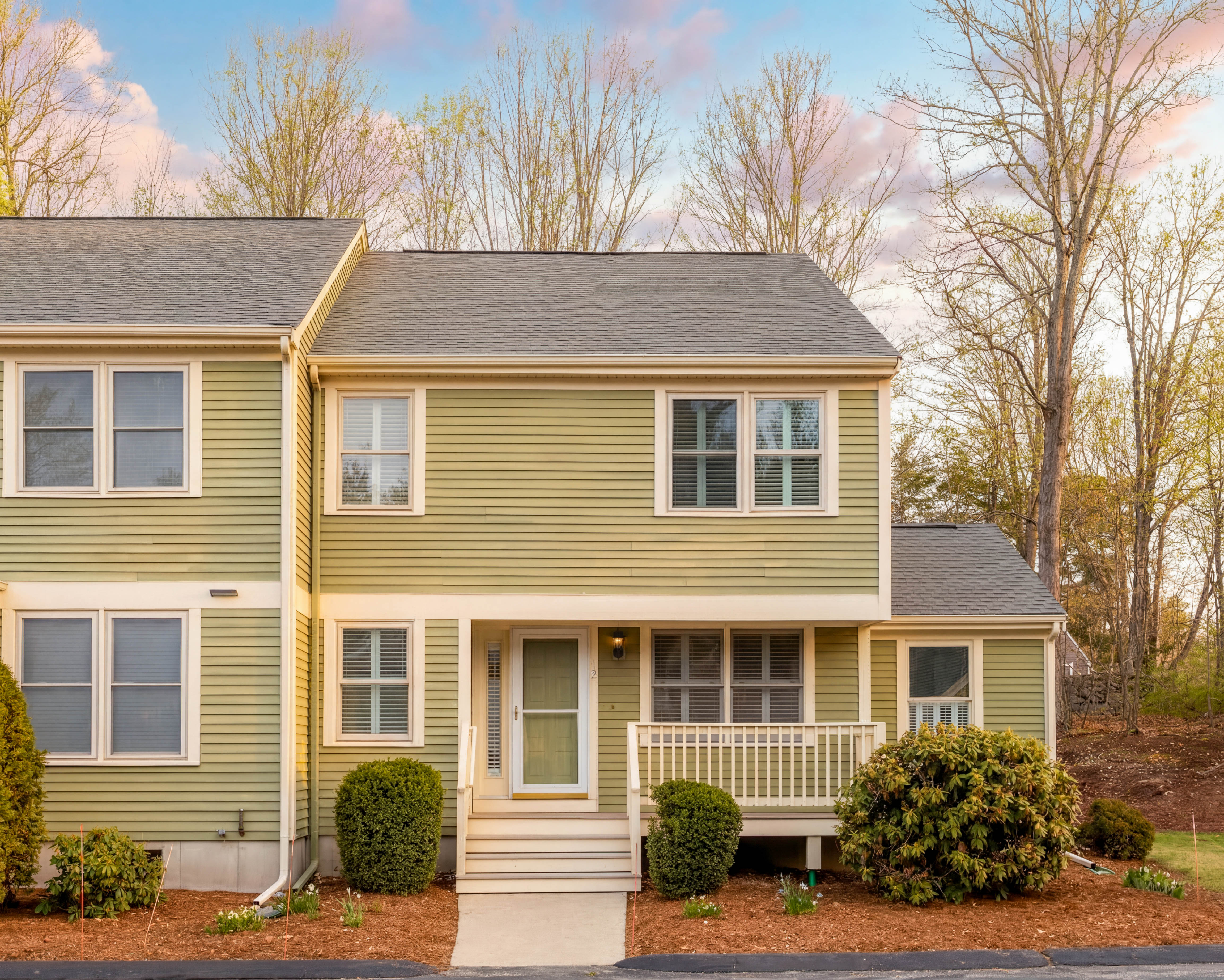 a front view of a house with a yard