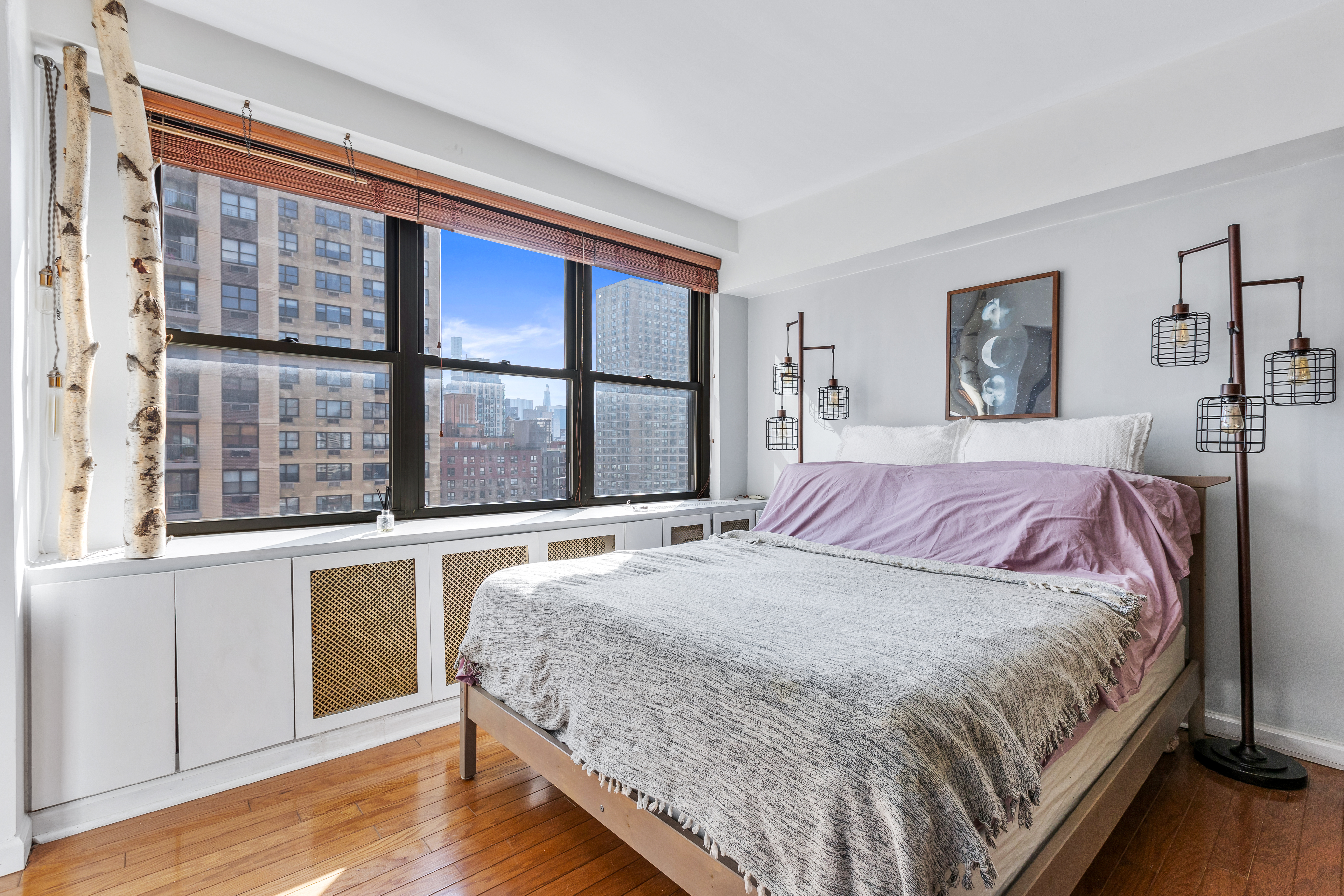 345 East 81st Street, Unit 19A Manhattan, NY 10028 - Photo 6 of 22 a bedroom with a large bed and a large window
