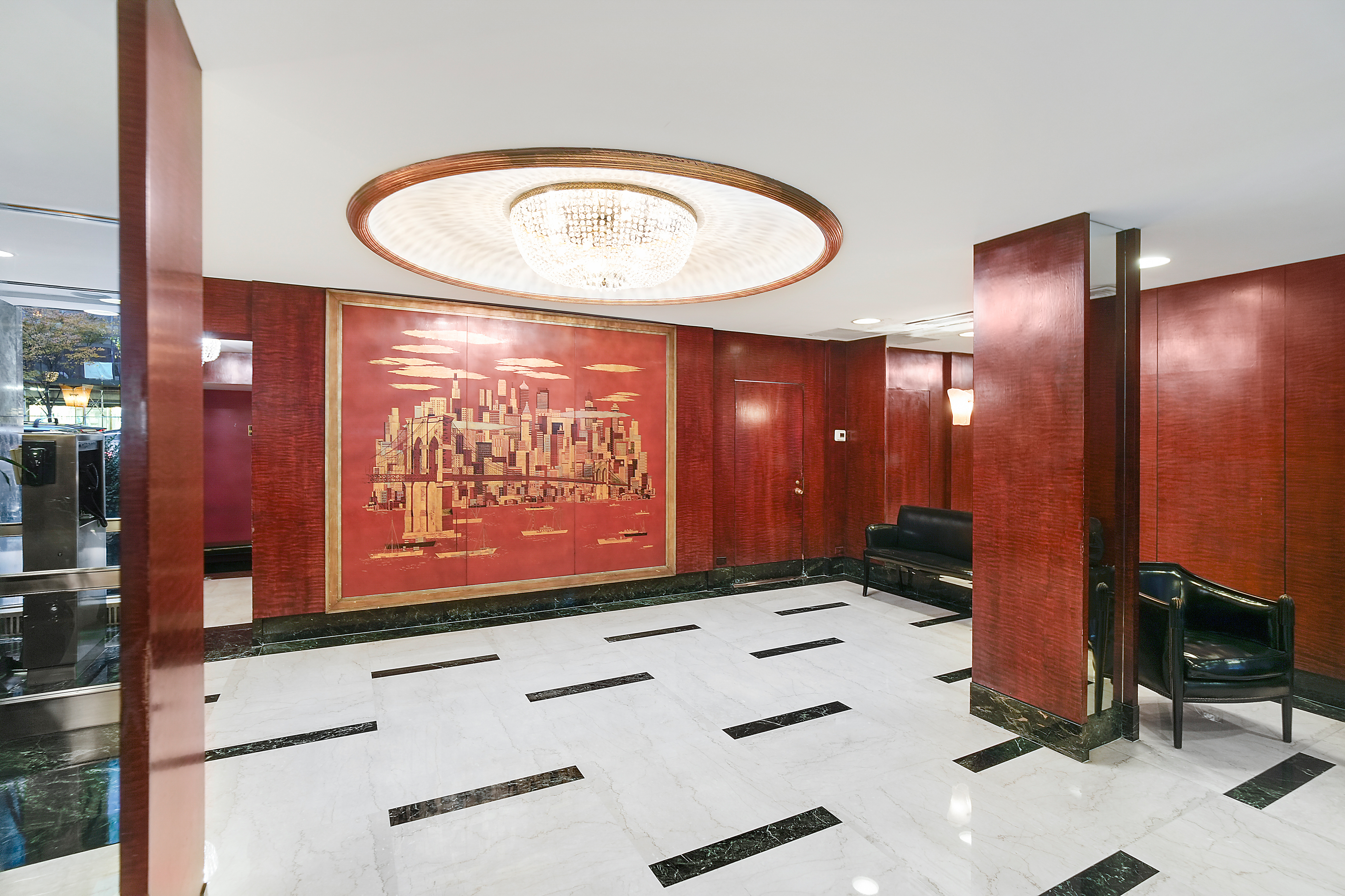 475 Park Avenue, Unit 11E Manhattan, NY 10022 - Photo 8 of 9 a bathroom with a sink a mirror and a shower