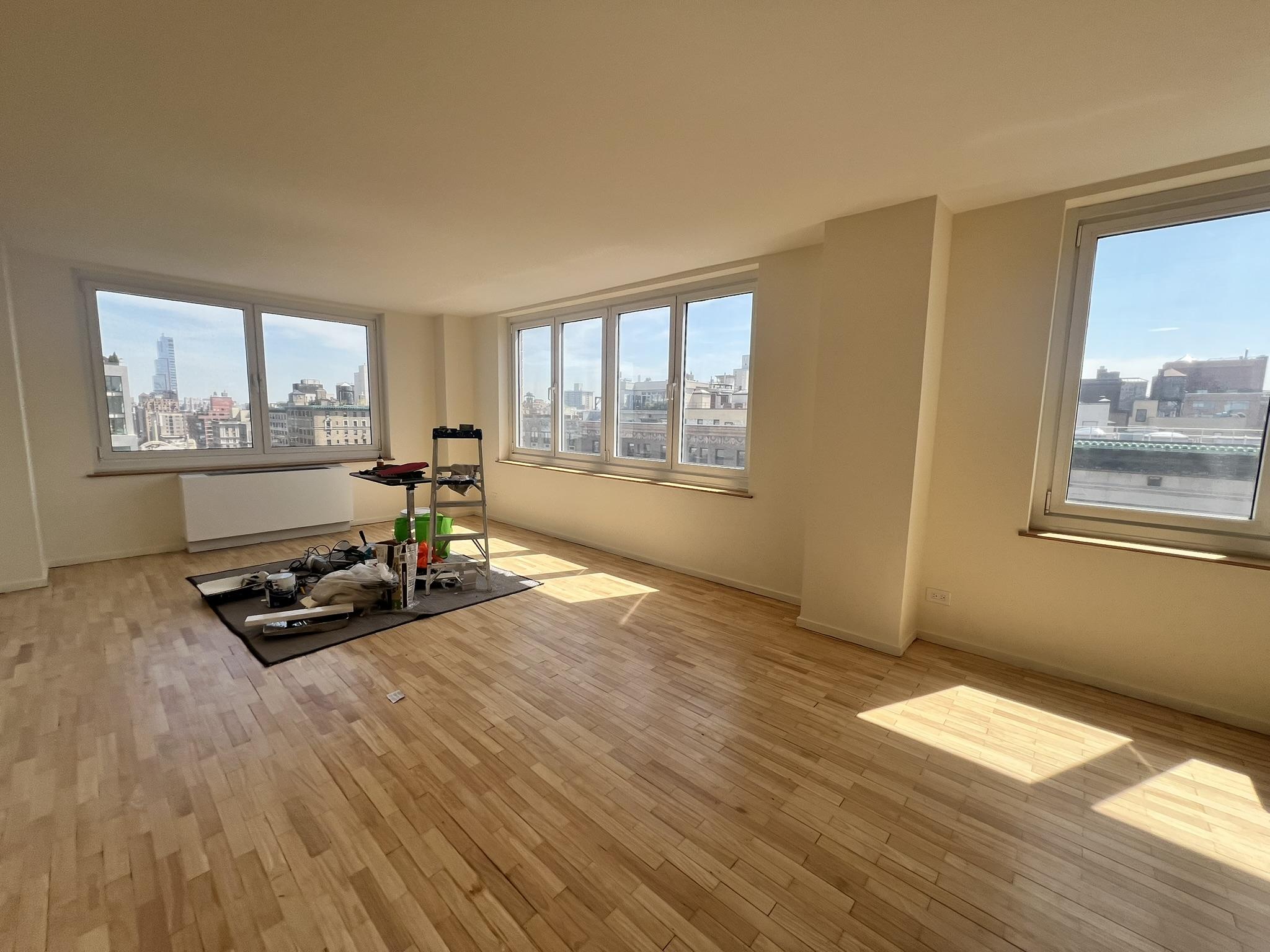 250 West 90th Street, Unit PH2F Manhattan, NY 10024 - Photo 6 of 21 a living room with hard wood floors and a window