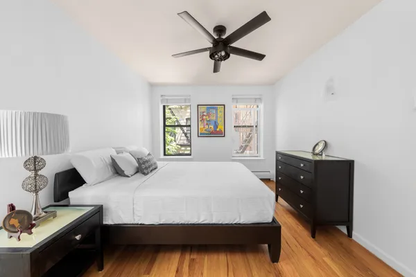 a bedroom with a bed and window