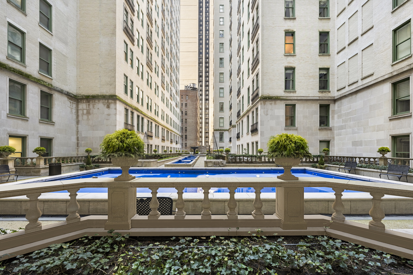 1 Central Park South, Unit 510 Manhattan, NY 10019 - Photo 5 of 23 a front view of a building with glass windows