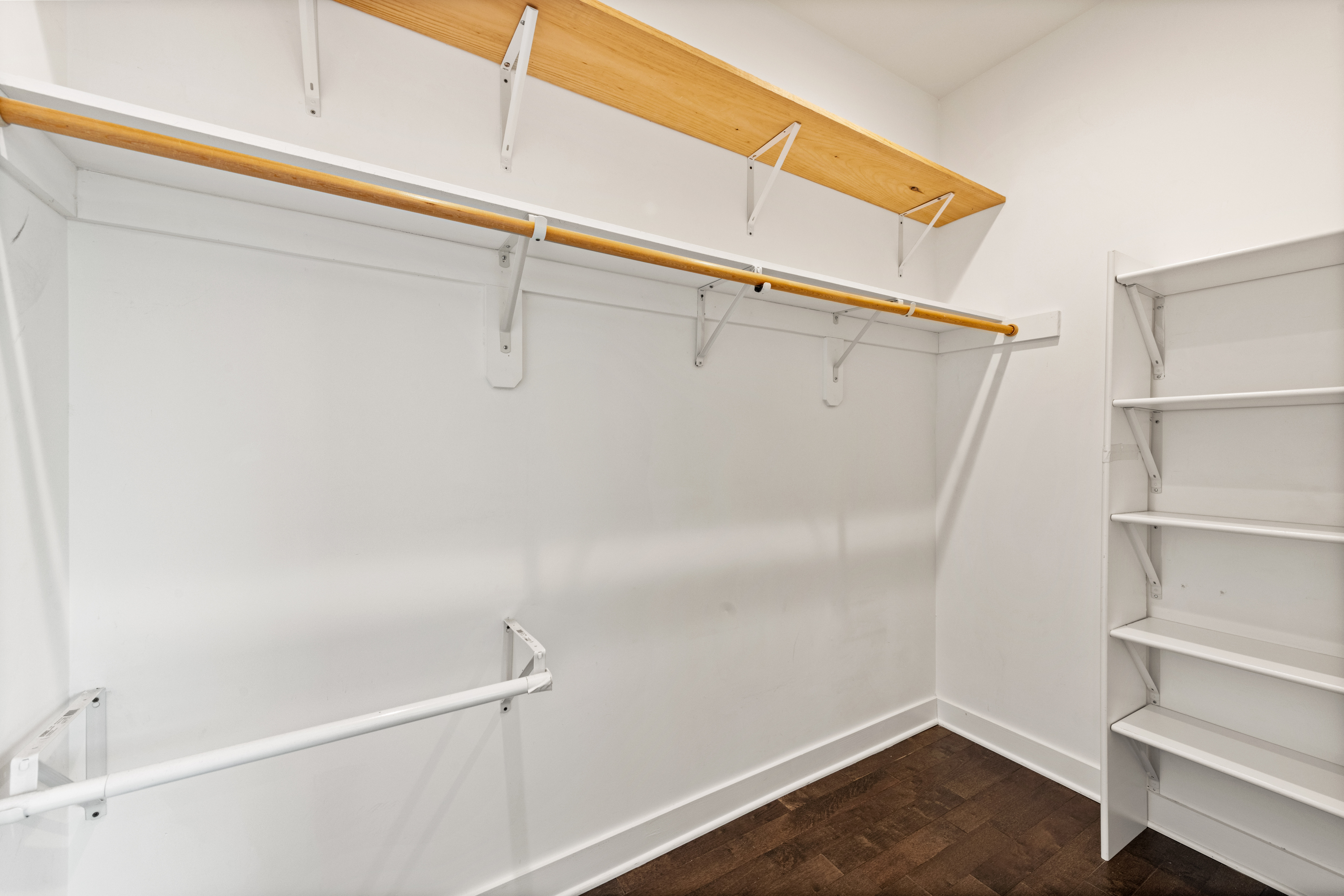 319 Varnum Street Northwest, Unit 3 Washington, DC 20011 - Photo 22 of 29 a view of walk in closet with empty racks