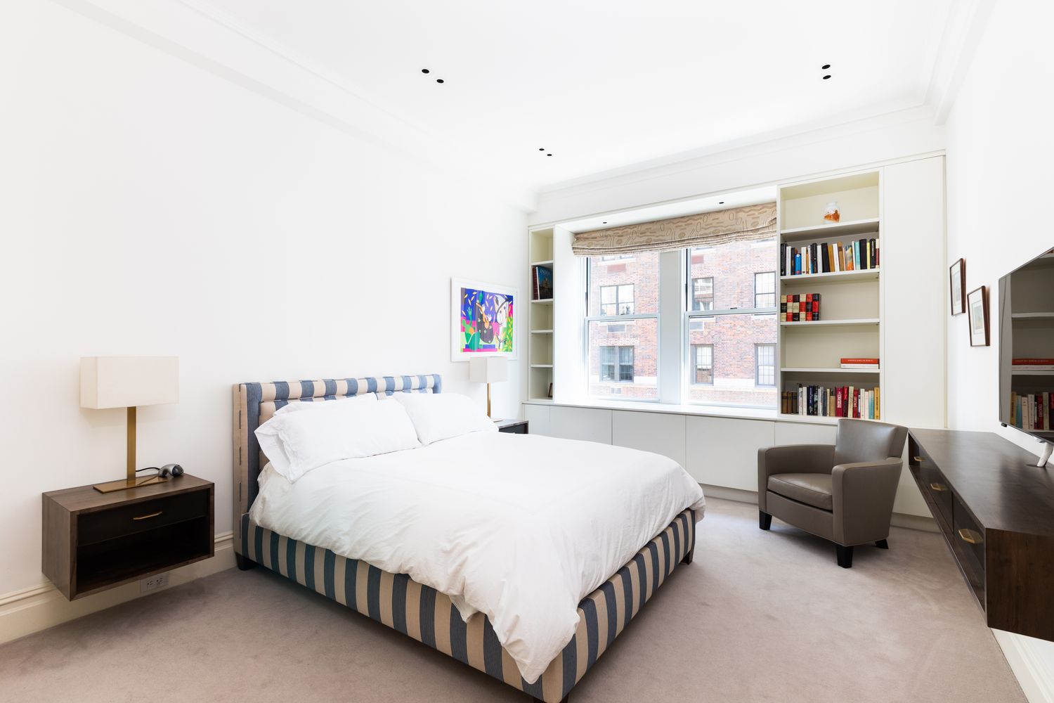 876 Park Avenue, Unit 7N Manhattan, NY 10075 - Photo 13 of 21 a bedroom with a bed and a window